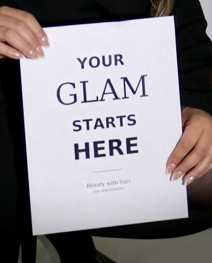 Sign reading Your Glam Starts Here